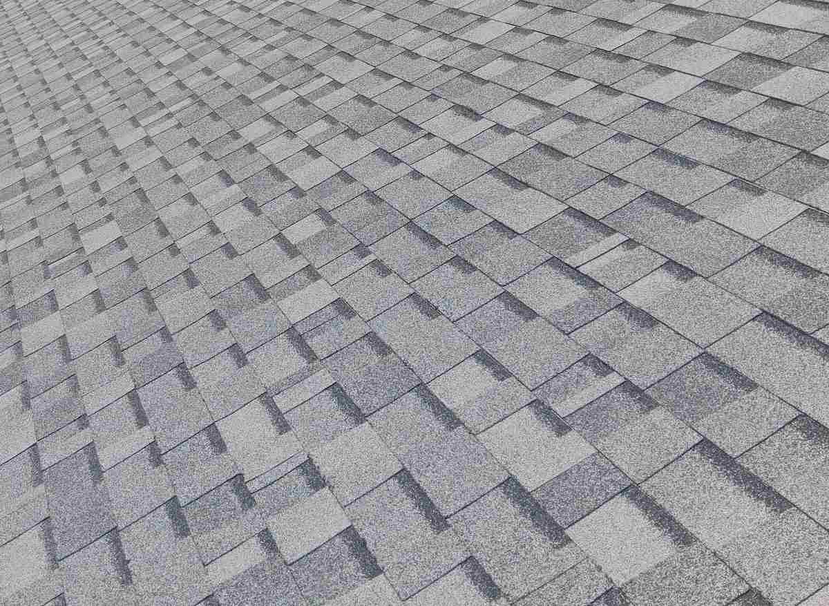 Close view of a light gray shingle roof field
